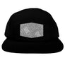 A black 5-panel camper hat with a flat visor, featuring a geometric pattern on the visor and a matching undervisor.