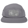 A grey 5-panel camper hat with a flat visor, featuring a geometric pattern on the visor and a matching undervisor.
